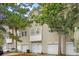 Charming townhome showcasing a two-story facade, private garages, and inviting curb appeal at 4551 Great Oak Dr, North Charleston, SC 29418