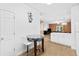 Eat in kitchen features a dining nook and white cabinets at 4551 Great Oak Dr, North Charleston, SC 29418