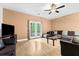 Cozy living room with ample seating, ceiling fan, and access to an outdoor deck at 4551 Great Oak Dr, North Charleston, SC 29418