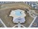 Aerial view of community pool with lounge area, cabana, playground, and parking at 490 Pender Woods Dr, Summerville, SC 29486
