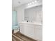 Bright bathroom featuring a shower with curtain, white vanity, and wood-look flooring at 490 Pender Woods Dr, Summerville, SC 29486
