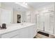 Bright bathroom featuring a shower, vanity with quartz counters, and wood-look flooring at 490 Pender Woods Dr, Summerville, SC 29486