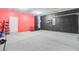 Spacious garage featuring painted walls, a dart board, and concrete floor, offering ample storage at 490 Pender Woods Dr, Summerville, SC 29486