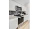 Modern kitchen featuring stainless steel appliances and granite countertops with tiled backsplash at 490 Pender Woods Dr, Summerville, SC 29486