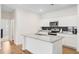 Clean kitchen with white cabinets, a center island, and stainless steel appliances at 490 Pender Woods Dr, Summerville, SC 29486