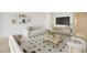 Cozy living room featuring neutral tones, a comfortable sofa, stylish rug, and modern decor at 490 Pender Woods Dr, Summerville, SC 29486