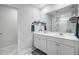 Bathroom featuring double vanity with white cabinetry and a large mirror with modern fixtures at 493 Spanish Wells Rd, Summerville, SC 29486