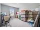 Neutral carpeted bedroom staged with office chair and packed cardboard boxes for moving at 493 Spanish Wells Rd, Summerville, SC 29486