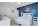 Bedroom featuring a blue accent wall, white furnishings and decor at 493 Spanish Wells Rd, Summerville, SC 29486