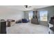 Neutral bedroom with beanbag chair and large windows offering natural light at 493 Spanish Wells Rd, Summerville, SC 29486