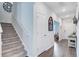 Hallway with staircase leading to bedrooms, featuring hardwood floors at 493 Spanish Wells Rd, Summerville, SC 29486
