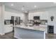 Modern kitchen with white cabinets, stainless steel appliances, and granite countertops on the island at 493 Spanish Wells Rd, Summerville, SC 29486