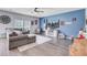 Open concept living room with a large TV and a comfortable sectional sofa at 493 Spanish Wells Rd, Summerville, SC 29486