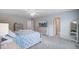 Well-lit main bedroom with a decorative bed, ensuite bathroom, and ample closet space at 493 Spanish Wells Rd, Summerville, SC 29486
