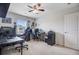 Home office with multiple workstations, natural light, and ceiling fan at 493 Spanish Wells Rd, Summerville, SC 29486