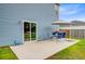 Exterior patio featuring blue siding, dining table and sliding door access to backyard at 493 Spanish Wells Rd, Summerville, SC 29486