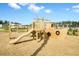 Nautical-themed playground featuring a wooden ship play structure with a slide and swings for to enjoy at 493 Spanish Wells Rd, Summerville, SC 29486