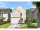 Backyard of home showing garage, small fenced area, basketball hoop and lush green grass at 4938 Ballantine Dr, Summerville, SC 29485