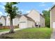 Backyard of home with white siding, small fenced area, basketball hoop, and grass at 4938 Ballantine Dr, Summerville, SC 29485