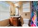 Cozy bathroom with granite countertop and a window offering lots of natural light at 4938 Ballantine Dr, Summerville, SC 29485