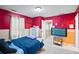 Bedroom with painted accent wall, bed, carpet, and TV at 4938 Ballantine Dr, Summerville, SC 29485