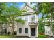 Inviting two-story home featuring classic siding, complemented by lush trees and landscaping at 4938 Ballantine Dr, Summerville, SC 29485