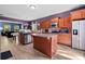 Well-appointed kitchen with an island, stainless steel appliances, and ample cabinet space at 4938 Ballantine Dr, Summerville, SC 29485