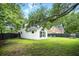 Exterior backyard of a two-story home featuring a well-maintained lawn and black privacy fence at 51 Stocker Dr, Charleston, SC 29407