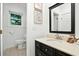 Bathroom featuring a black vanity with marble countertop and modern fixtures at 51 Stocker Dr, Charleston, SC 29407