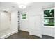 Bright bathroom featuring a walk-in shower and storage at 51 Stocker Dr, Charleston, SC 29407