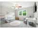 Cozy Bedroom featuring a white crib, soft rug, and a comfortable recliner at 51 Stocker Dr, Charleston, SC 29407