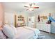 Charming bedroom with a ceiling fan, dresser, and built-in shelves for an organized and personalized touch at 51 Stocker Dr, Charleston, SC 29407