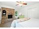 Bedroom featuring a brick fireplace, ceiling fan, and a comfortable bed at 51 Stocker Dr, Charleston, SC 29407