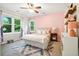 Bright bedroom with windows providing lots of light, a plush bed, and a colorful accent wall at 51 Stocker Dr, Charleston, SC 29407