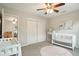 Charming Bedroom with a white crib, soft rug, and ample closet space at 51 Stocker Dr, Charleston, SC 29407