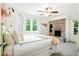 Bright bedroom with a decorative brick fireplace, a cozy bed, and lots of natural light at 51 Stocker Dr, Charleston, SC 29407
