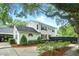 Spacious two-story home featuring manicured landscaping, a black fence, and a charming exterior design at 51 Stocker Dr, Charleston, SC 29407