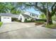 Charming two-story home with well-manicured lawn and mature trees at 51 Stocker Dr, Charleston, SC 29407