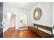Inviting foyer featuring hardwood floors, a decorative mirror, and a staircase at 51 Stocker Dr, Charleston, SC 29407