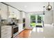 Bright kitchen featuring stainless appliances, quartz countertops, and a view to the backyard at 51 Stocker Dr, Charleston, SC 29407