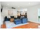 Inviting living room with stylish blue sectional sofa, decorative rug, and hardwood floors at 51 Stocker Dr, Charleston, SC 29407