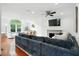 Open-concept living room with ample seating, fireplace, and view to dining area at 51 Stocker Dr, Charleston, SC 29407