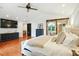 Main bedroom features TV, hardwood floors, accent wall, and natural light at 51 Stocker Dr, Charleston, SC 29407