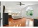 Spacious main bedroom with hardwood floors, large windows, and stylish furniture at 51 Stocker Dr, Charleston, SC 29407