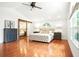 Bright main bedroom with hardwood floors, vaulted ceiling, and barn door closet at 51 Stocker Dr, Charleston, SC 29407