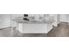 Modern kitchen island featuring granite countertops, a stainless steel sink, and ample storage space at 542 Verdi Dr, Summerville, SC 29486