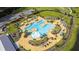 Overhead shot of pool area with umbrellas, splash area, seating and landscaping at 542 Verdi Dr, Summerville, SC 29486