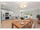 Open concept kitchen and dining area, featuring modern cabinets, stainless steel appliances, and stylish pendant lighting at 5133 Park Creek Ave, North Charleston, SC 29418