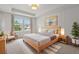 Inviting main bedroom with large window, decorative molding, and neutral colors at 5133 Park Creek Ave, North Charleston, SC 29418