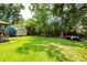 Grassy backyard with shed for lawn equipment at 5209 Sterrett St, North Charleston, SC 29405